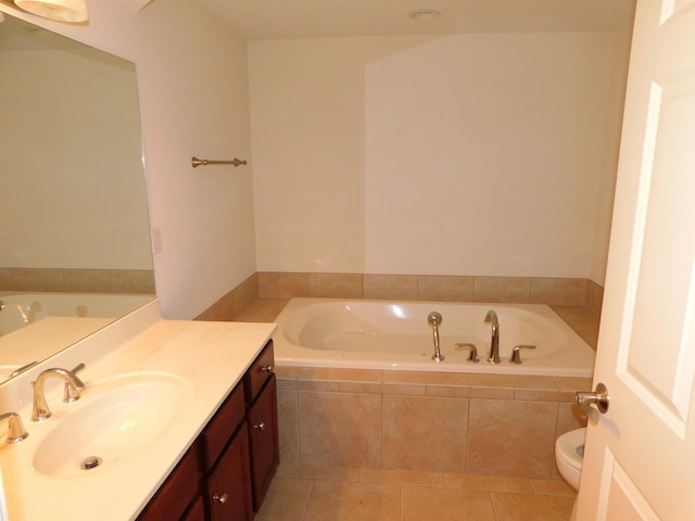 2535 Holiday House Rd Unit 24, Saint Joseph, MI 49085 - full bathroom featuring a garden tub, tile patterned flooring, vanity, and toilet