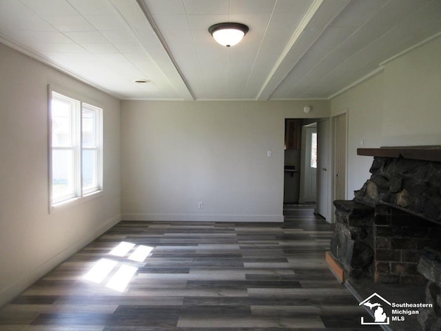 4393 2nd St, Newport, MI 48166 - living area with a stone fireplace, baseboards, and wood finished floors