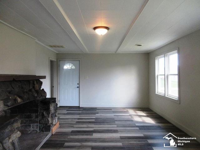 4393 2nd St, Newport, MI 48166 - foyer featuring a fireplace, visible vents, baseboards, and wood finished floors