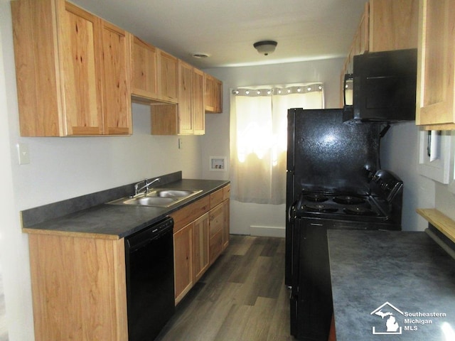 4393 2nd St, Newport, MI 48166 - kitchen featuring a sink, black appliances, dark countertops, and dark wood finished floors