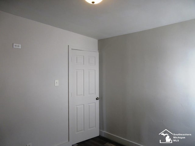 4393 2nd St, Newport, MI 48166 - empty room featuring baseboards and dark wood finished floors