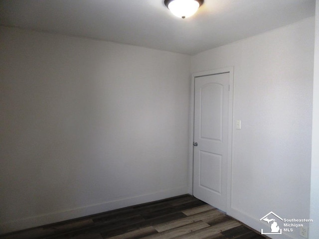 4393 2nd St, Newport, MI 48166 - unfurnished room featuring dark wood-type flooring and baseboards