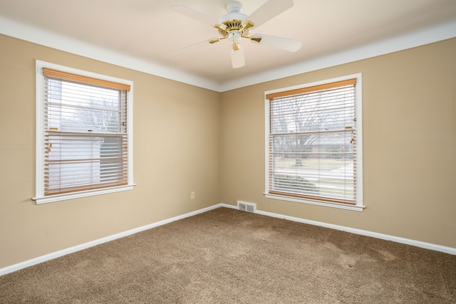 341 Ridgemont Rd, Grosse Pointe Farms, MI 48236 - carpeted spare room with baseboards, visible vents, and a ceiling fan