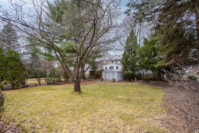 341 Ridgemont Rd, Grosse Pointe Farms, MI 48236 - view of yard featuring an outdoor structure, a fenced backyard, and a storage unit