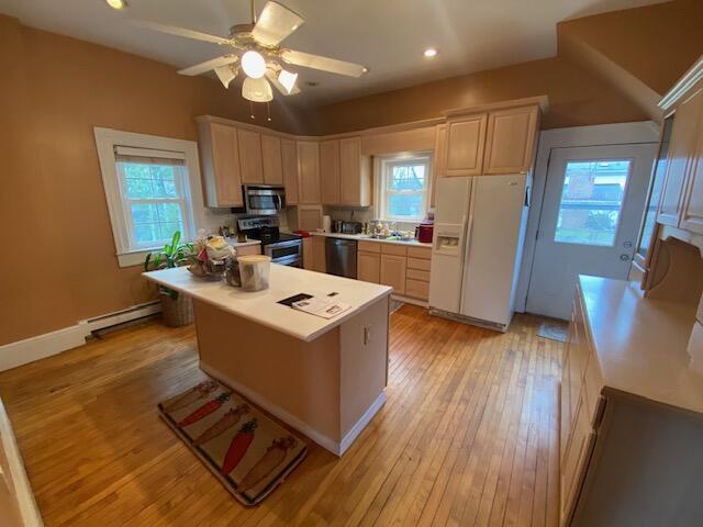 227 Railroad St, Chelsea, MI 48118 - kitchen featuring stainless steel appliances, a baseboard radiator, plenty of natural light, ceiling fan, and recessed lighting
