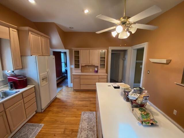 227 Railroad St, Chelsea, MI 48118 - kitchen featuring light wood-style floors, a ceiling fan, light countertops, white fridge with ice dispenser, and lofted ceiling