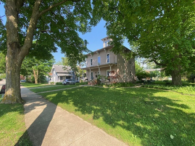 227 Railroad St, Chelsea, MI 48118 - italianate-style house with a front yard