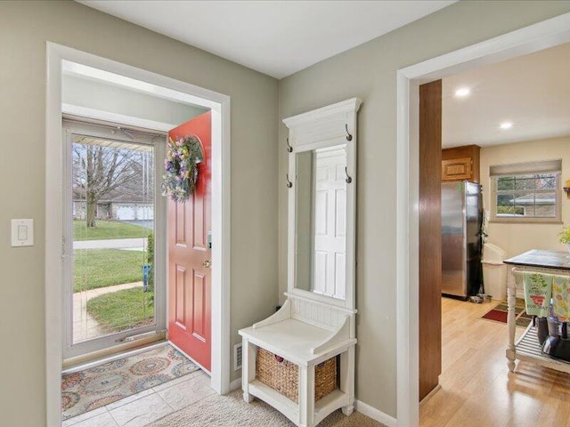 entrance foyer featuring baseboards and recessed lighting