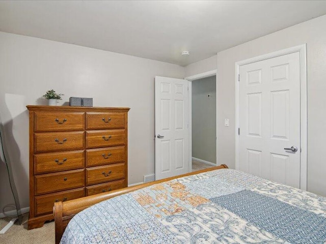 carpeted bedroom featuring baseboards
