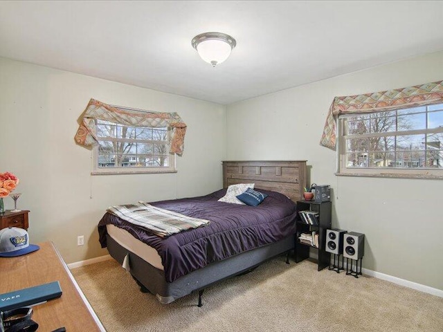 bedroom featuring baseboards and carpet floors