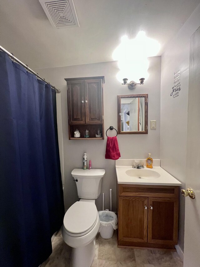 4480 Stanton Blvd, Montague, MI 49437 - full bath with visible vents, toilet, vanity, and a shower with shower curtain