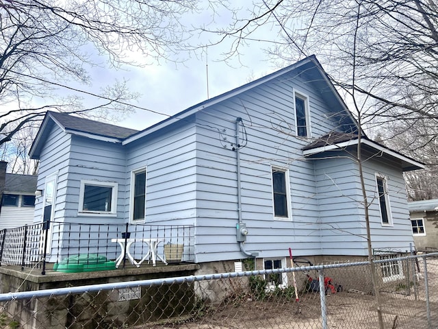 4480 Stanton Blvd, Montague, MI 49437 - view of side of home featuring a fenced front yard
