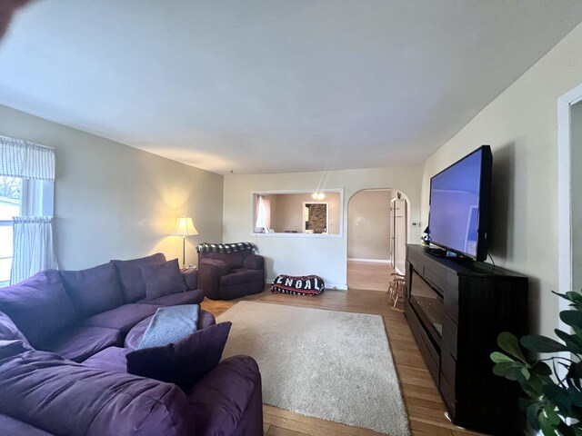 4480 Stanton Blvd, Montague, MI 49437 - living area featuring arched walkways and dark wood finished floors
