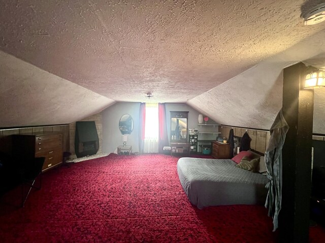 4480 Stanton Blvd, Montague, MI 49437 - carpeted bedroom with lofted ceiling and a textured ceiling