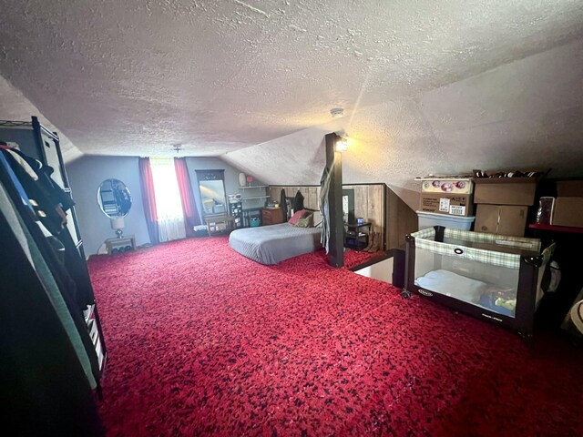 4480 Stanton Blvd, Montague, MI 49437 - bedroom with a textured ceiling, vaulted ceiling, and carpet
