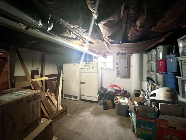 4480 Stanton Blvd, Montague, MI 49437 - below grade area with electric panel and freestanding refrigerator