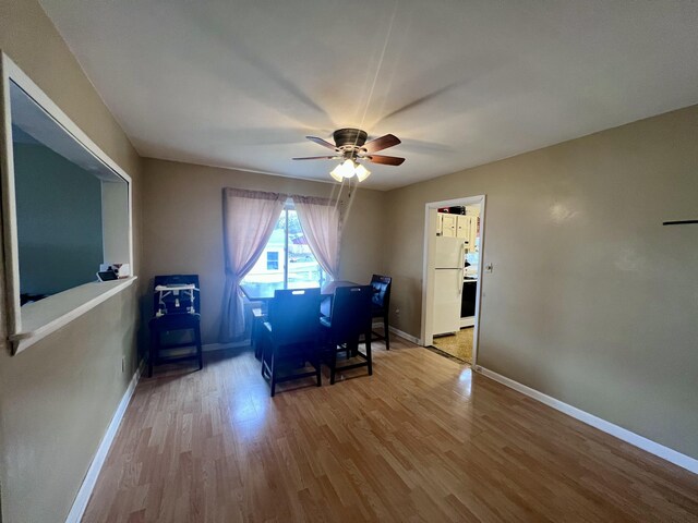 4480 Stanton Blvd, Montague, MI 49437 - unfurnished dining area with baseboards, wood finished floors, and a ceiling fan