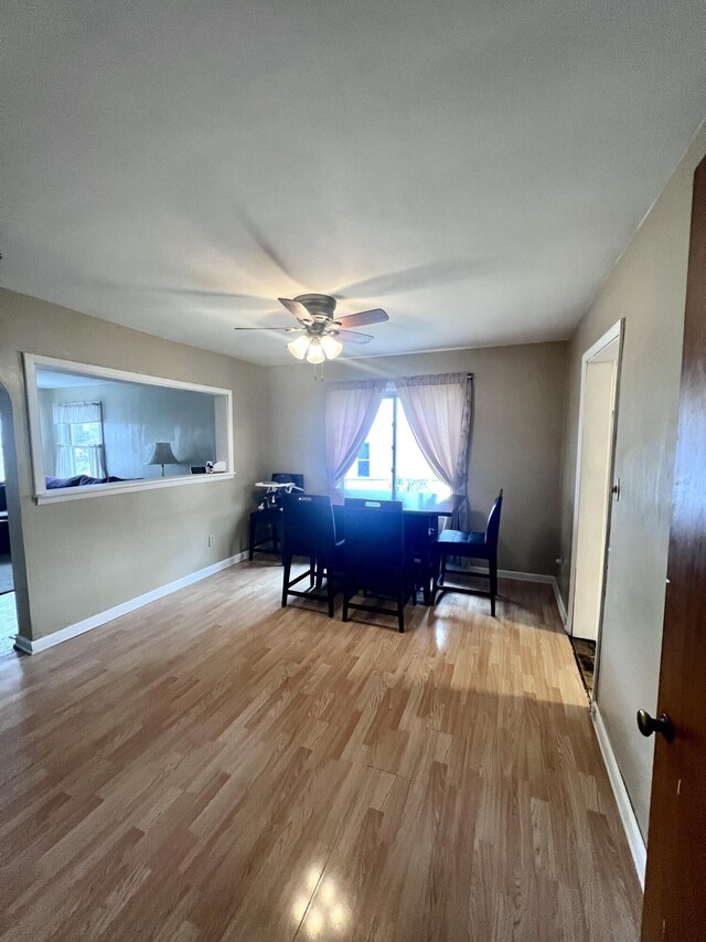 4480 Stanton Blvd, Montague, MI 49437 - unfurnished dining area featuring baseboards, wood finished floors, and ceiling fan