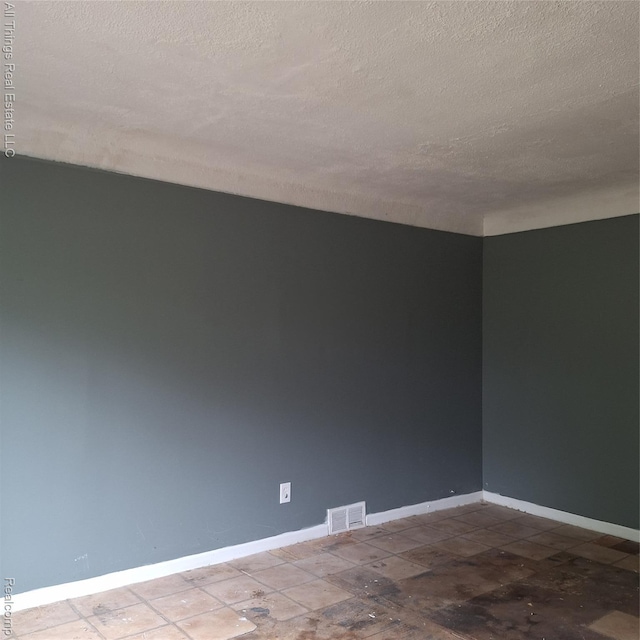 15368 Greydale St, Detroit, MI 48223 - spare room featuring a textured ceiling and baseboards