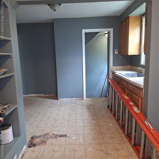 15368 Greydale St, Detroit, MI 48223 - kitchen featuring light countertops and brown cabinetry