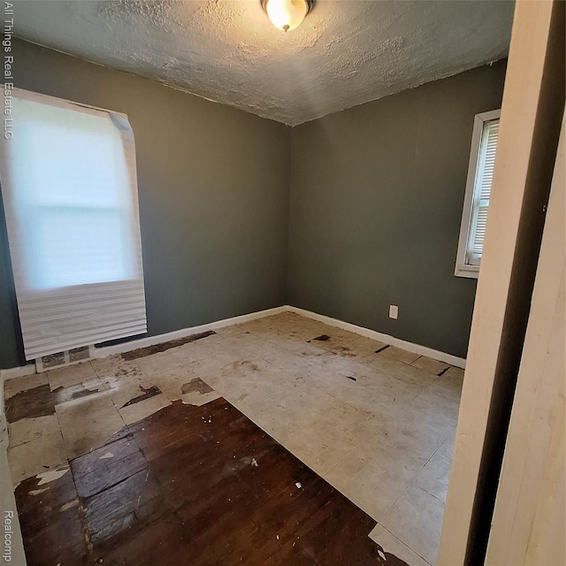 15368 Greydale St, Detroit, MI 48223 - empty room with a textured ceiling and baseboards
