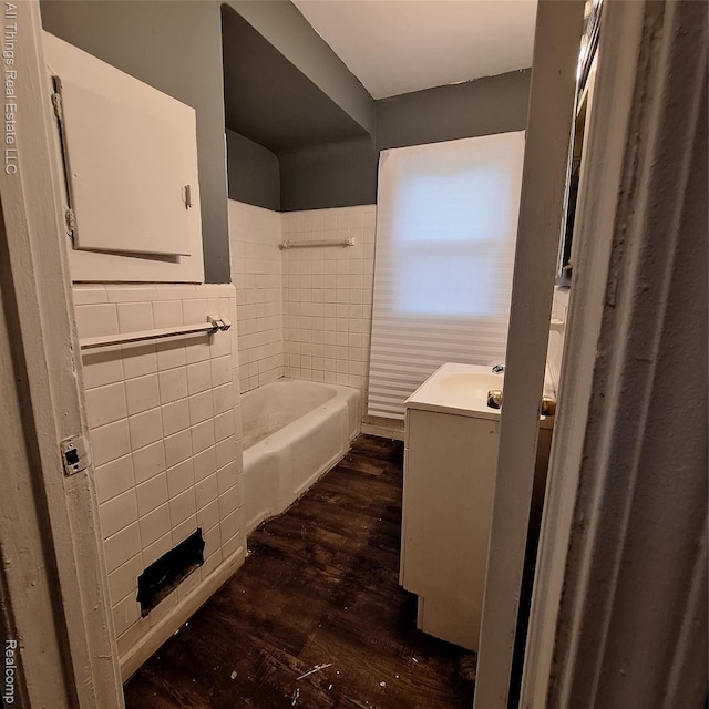 15368 Greydale St, Detroit, MI 48223 - full bathroom with tile walls, vanity, wood finished floors, a bath, and a wainscoted wall
