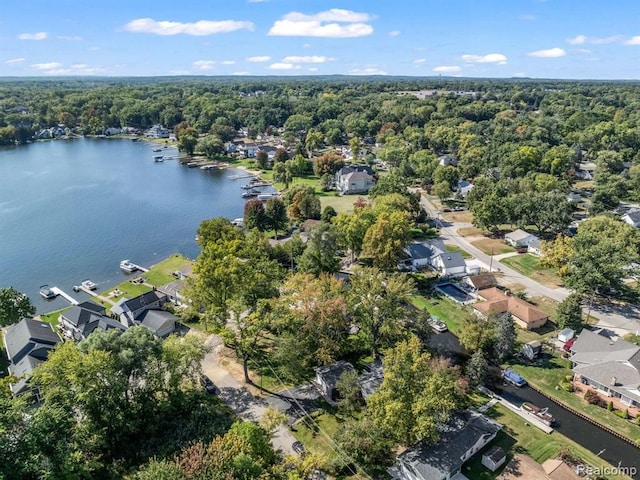 bird's eye view featuring a water view, a residential view, and a forest view
