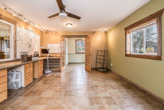home office with baseboards, rail lighting, and ceiling fan