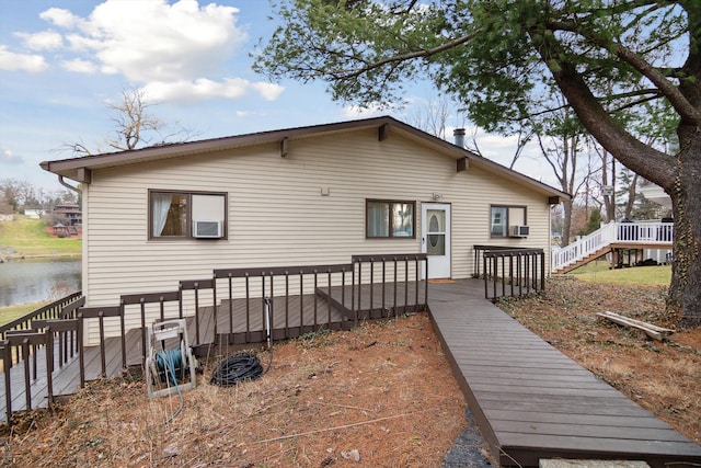 back of house with a deck with water view and cooling unit