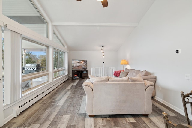 living room featuring lofted ceiling, a baseboard heating unit, baseboards, ceiling fan, and wood finished floors