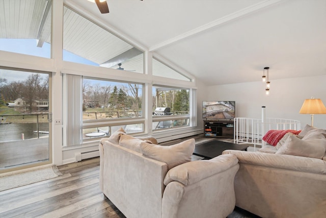 living area featuring baseboard heating, a ceiling fan, wood finished floors, and lofted ceiling with beams