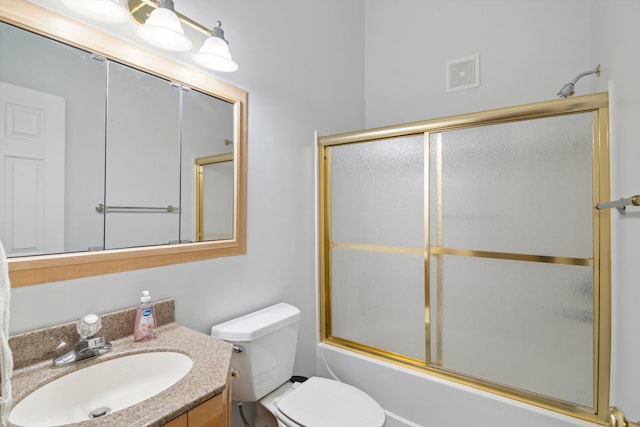 full bath with visible vents, shower / bath combination with glass door, toilet, and vanity