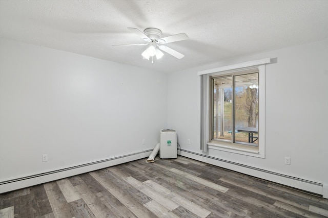 spare room featuring a baseboard radiator, a ceiling fan, a textured ceiling, and wood finished floors