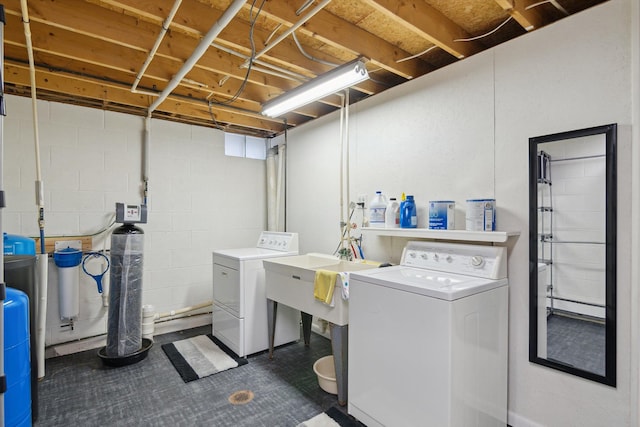 washroom with separate washer and dryer and laundry area