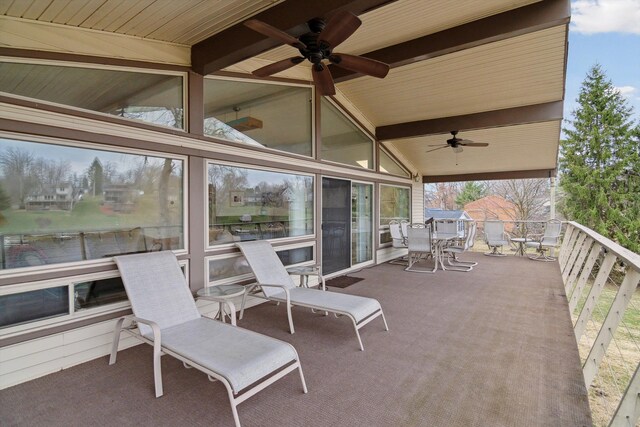view of patio / terrace featuring outdoor dining space, a balcony, and ceiling fan