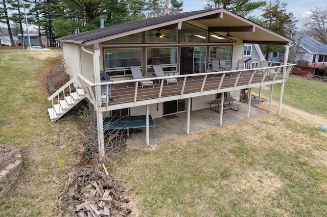 view of front facade with a ceiling fan, a patio area, a deck, and stairs