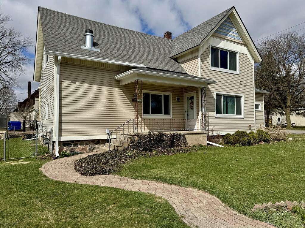 73981 Church St, Armada, MI 48005 - view of front of home featuring a gate, a chimney, a front lawn, and roof with shingles