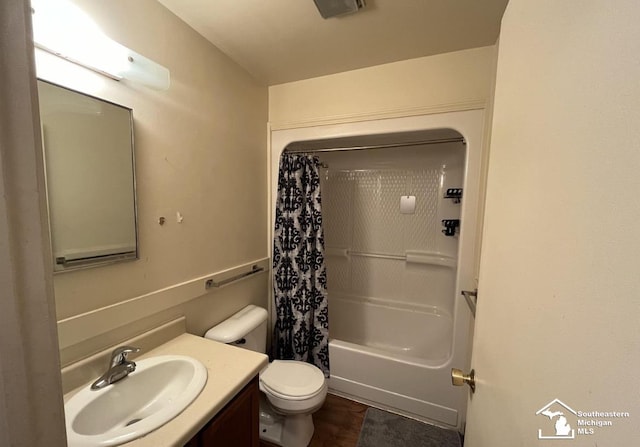 bathroom featuring shower / bath combination with curtain, toilet, and vanity