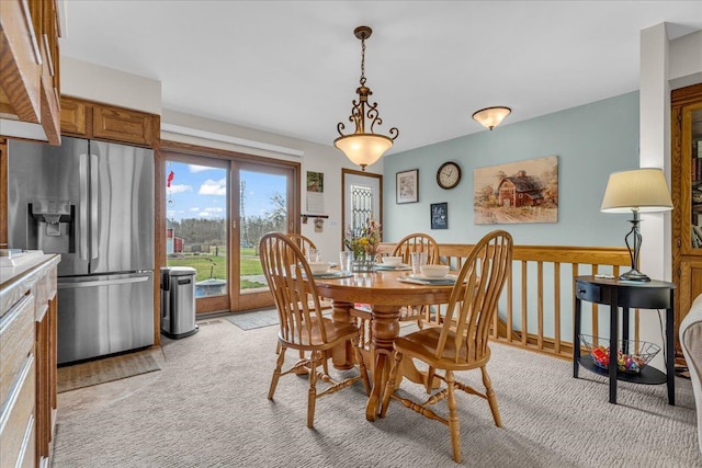 dining room with light carpet