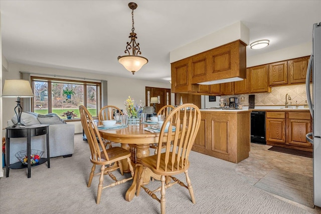 dining area with light colored carpet