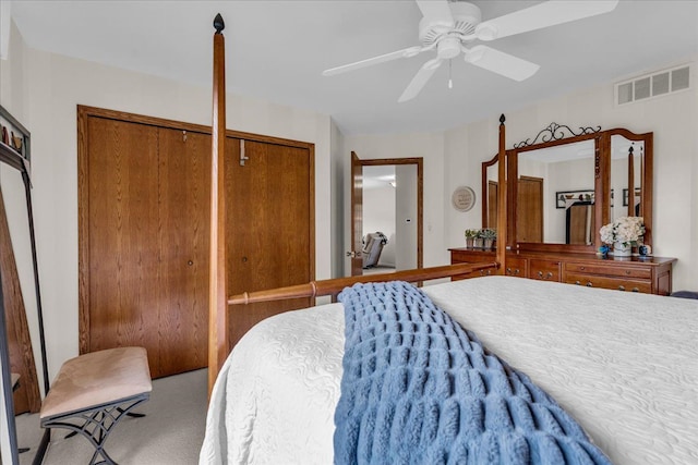 bedroom featuring visible vents, ceiling fan, and carpet