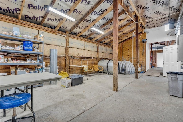 miscellaneous room featuring unfinished concrete flooring