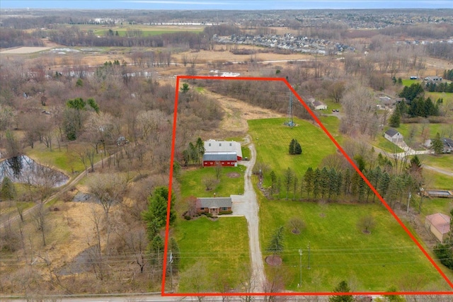 birds eye view of property with a rural view