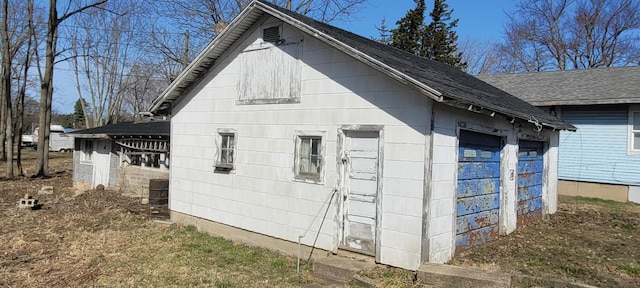 5640 Blue Star Hwy, South Haven, MI 49090 - view of property exterior with a barn, an outbuilding, a garage, and a shingled roof