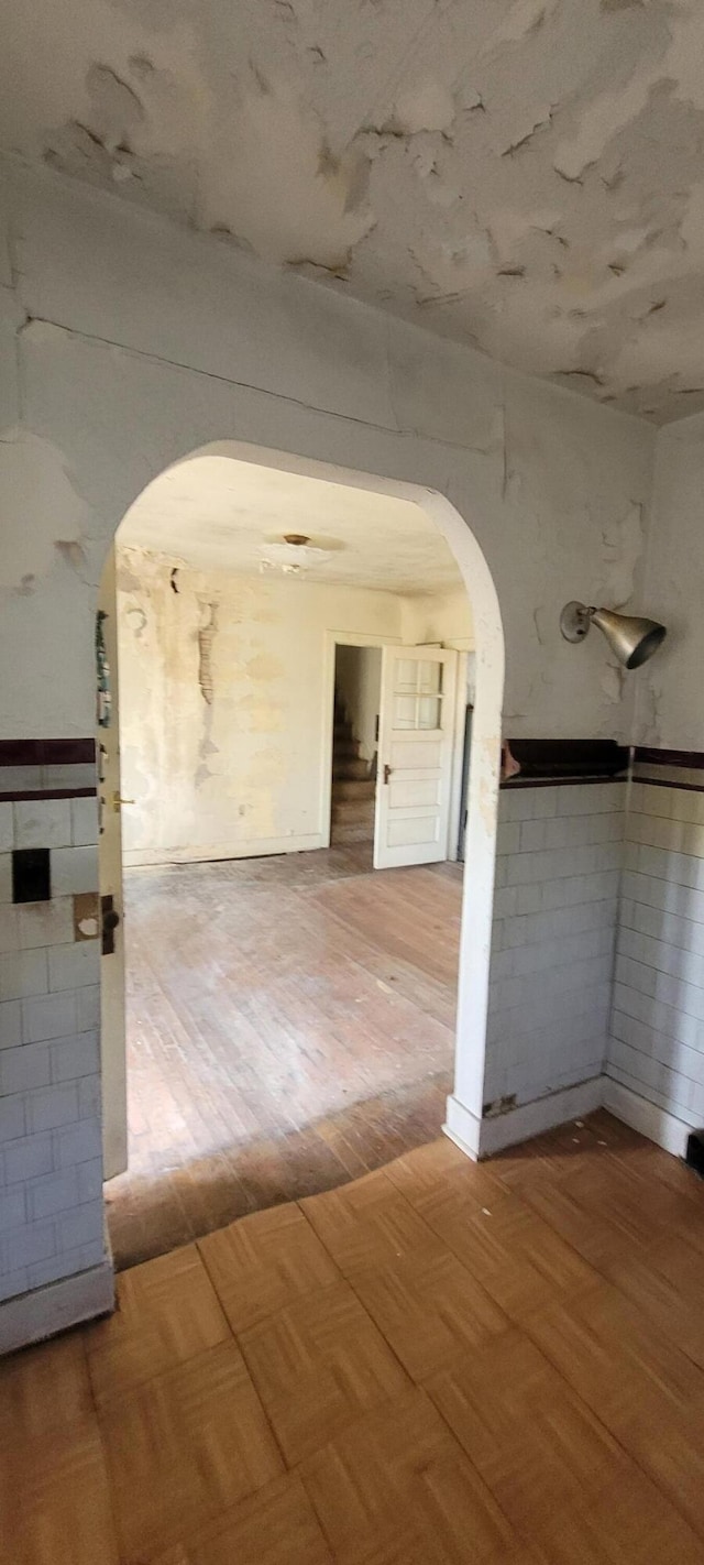 5640 Blue Star Hwy, South Haven, MI 49090 - spare room with arched walkways and parquet flooring