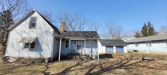 5640 Blue Star Hwy, South Haven, MI 49090 - view of front of house with an outdoor structure and a chimney