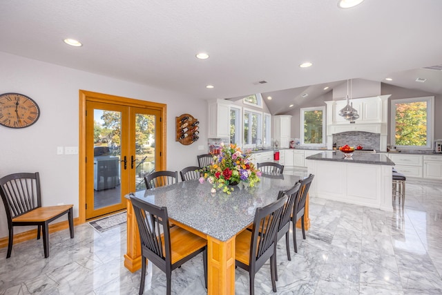 8366 Lynwood Ln, Mecosta, MI 49332 - dining area featuring vaulted ceiling, french doors, marble finish floor, visible vents, and recessed lighting