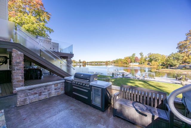 8366 Lynwood Ln, Mecosta, MI 49332 - view of patio / terrace featuring grilling area, a dock, and a water view