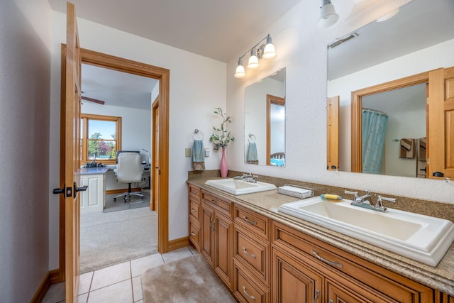 8366 Lynwood Ln, Mecosta, MI 49332 - full bath with tile patterned flooring, a sink, double vanity, and visible vents