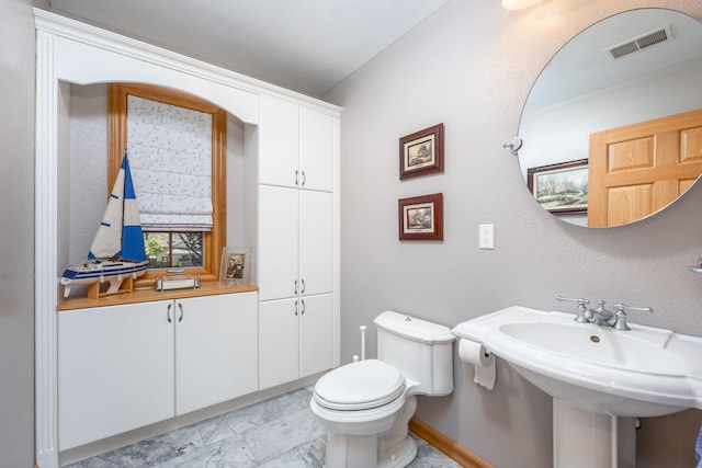 8366 Lynwood Ln, Mecosta, MI 49332 - half bath featuring marble finish floor, visible vents, toilet, and a sink